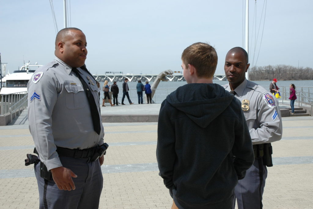Cops talking to teenager